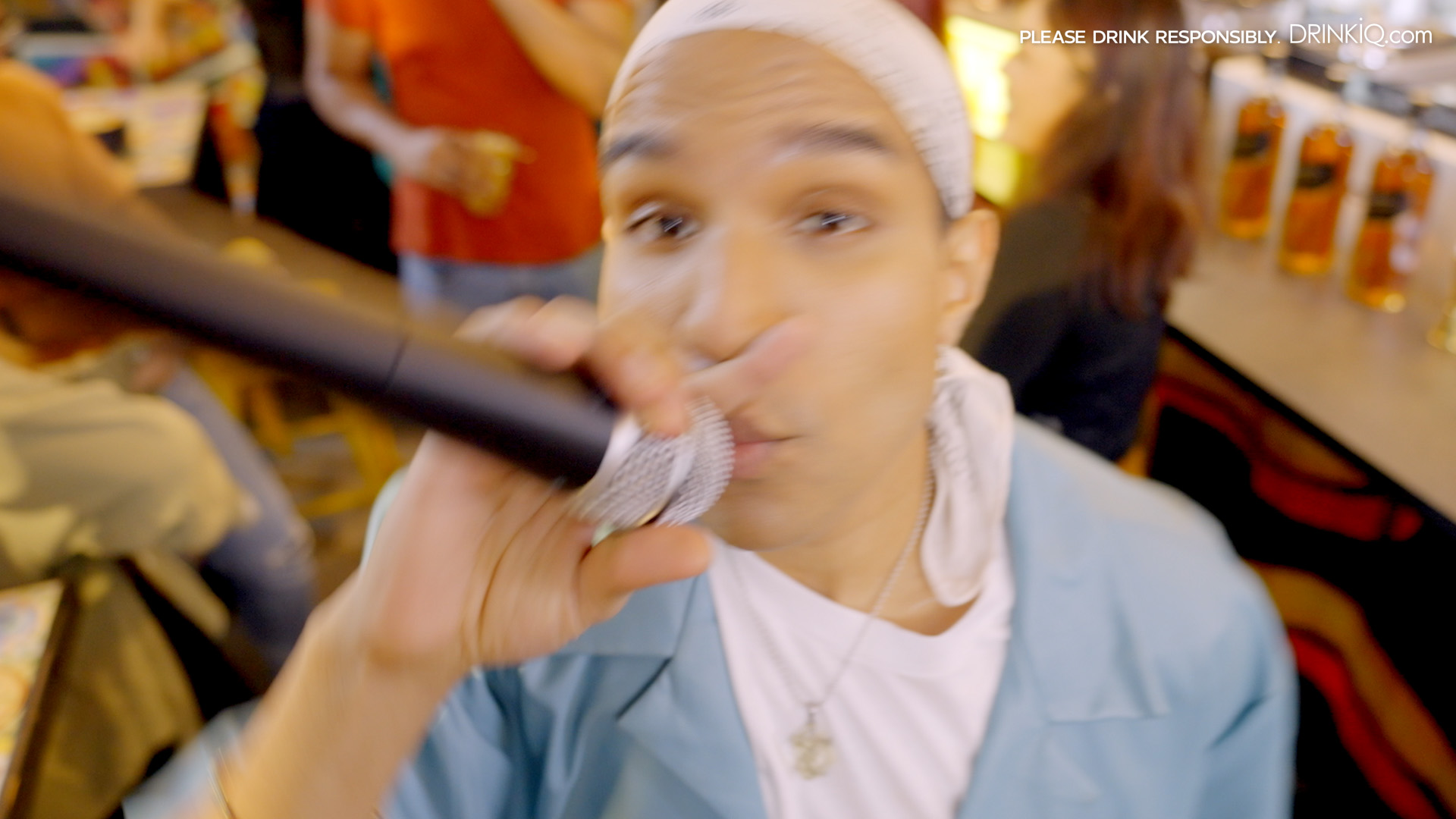 Yung Raja holding microphne rapping
